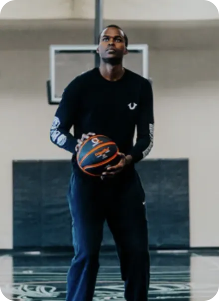 Kris Wilkes holding basketball